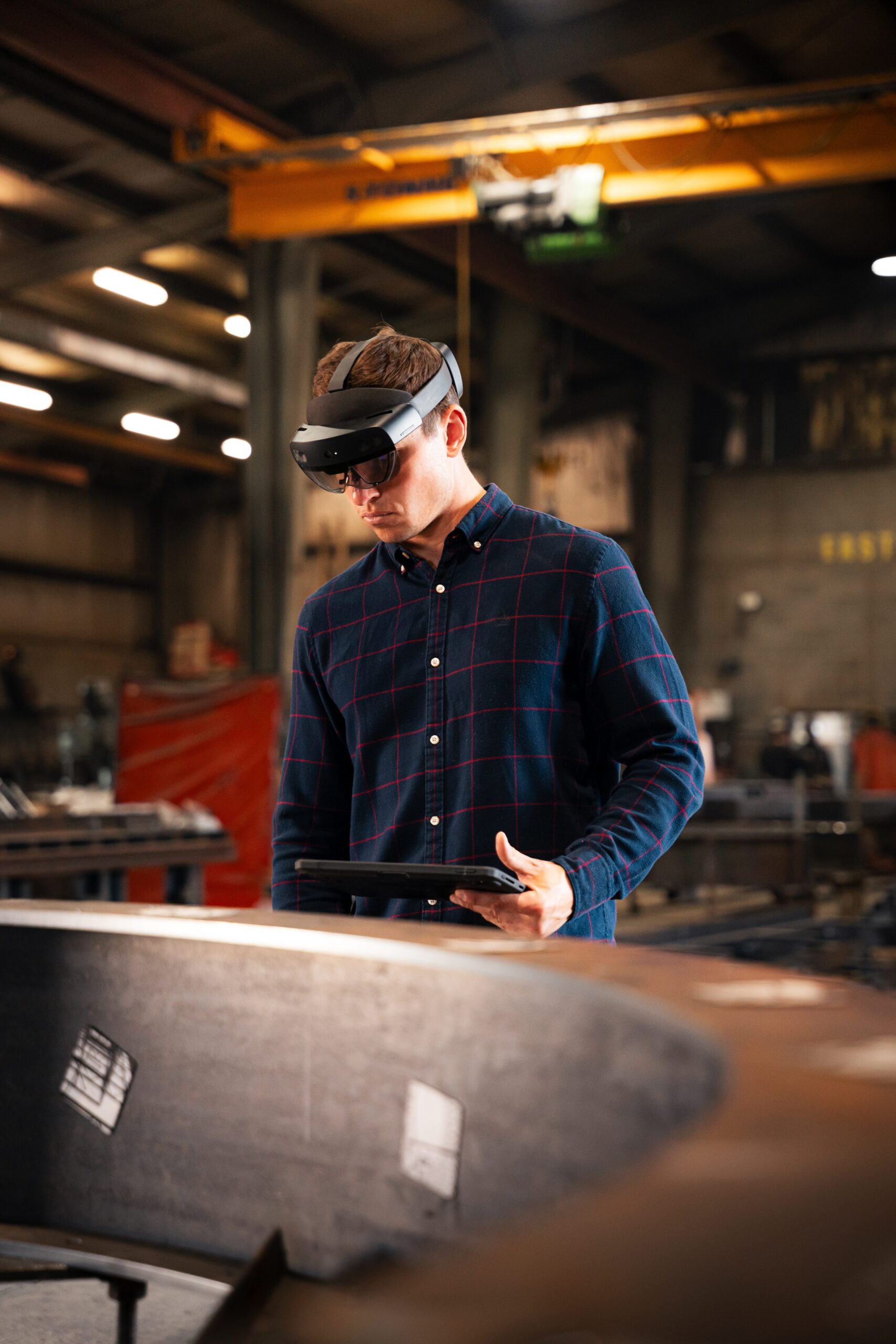 Fabricator using an AR headset on the shop floor